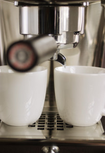 Two cups and espresso machine